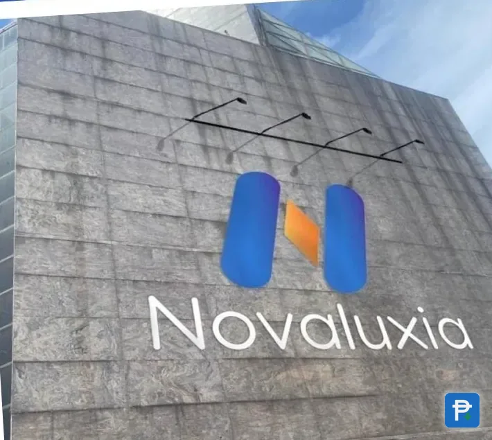 The Novaluxia PH office building in Makati, with the company sign above the entrance and a published address anyone can visit