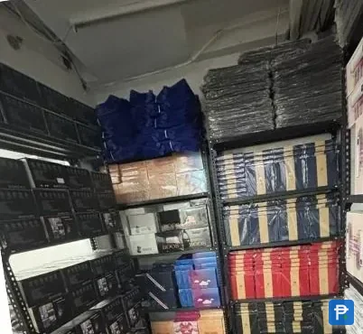 Shelves of boxed stock inside the Novaluxia warehouse, the point an order reaches before a courier sees it
