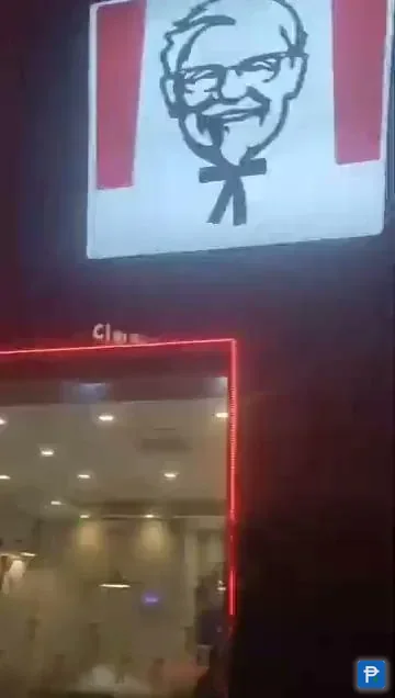 KFC storefront sign lit up at night, one of the merchants a Novaluxia PH points voucher can be redeemed at